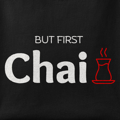Close-up of the But First Chai print showing ink detail on the fabric