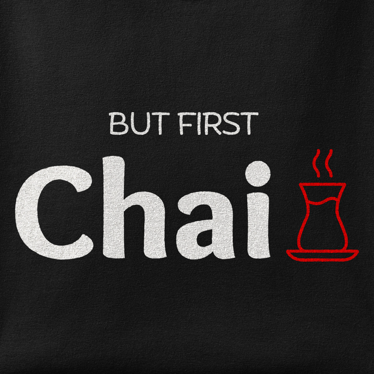 Close-up of the But First Chai print showing ink detail on the fabric