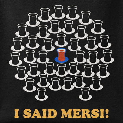 Close-up of the I Said Mersi print showing ink detail on the fabric
