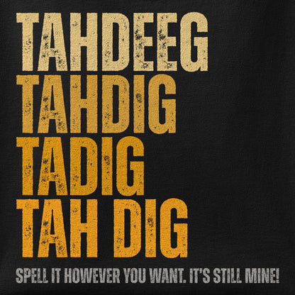 Close-up of the Spelling Tahdeeg print showing ink detail on the fabric