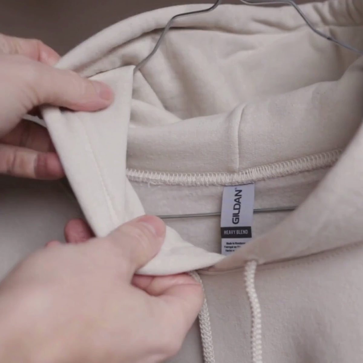 Hoodie close-up video: fabric, collar, stitching and fit